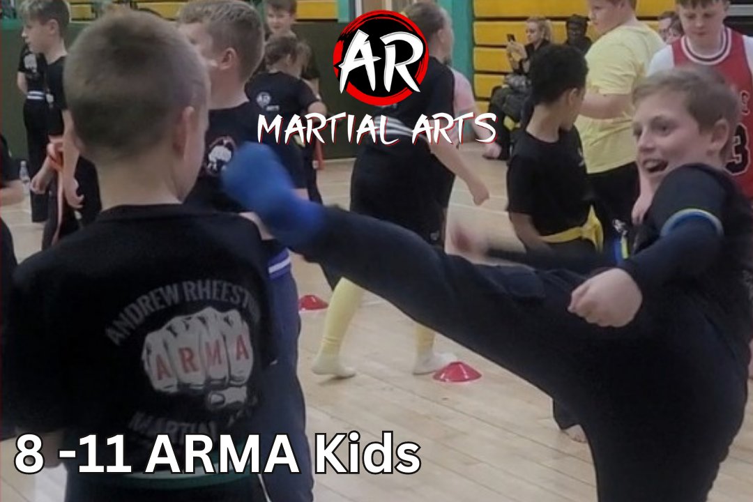AR Martial Arts students aged eight to eleven practising controlled kicks